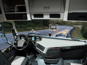 Self driving truck with head up display on a road. Inside view