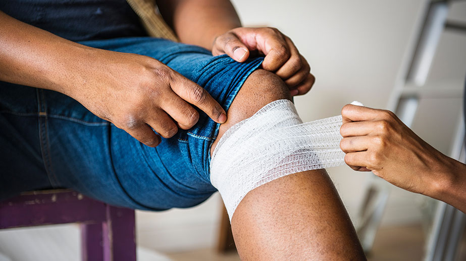 Person having bandage wrapped below the knee